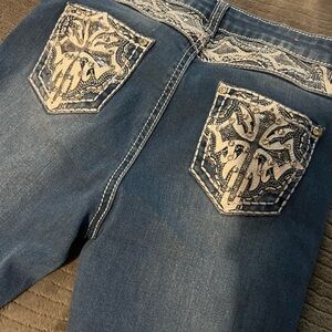 Embellished Blue Jeans with Intricate Pocket Design